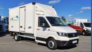 Modern temperature-controlled delivery vehicle navigating Dubai streets
